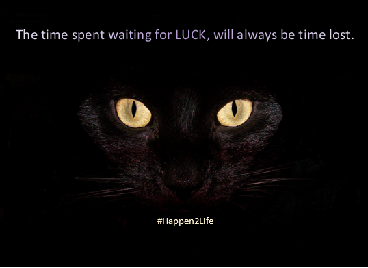 Image of a black cat with bright wide eyes. Includes #Happen2Life